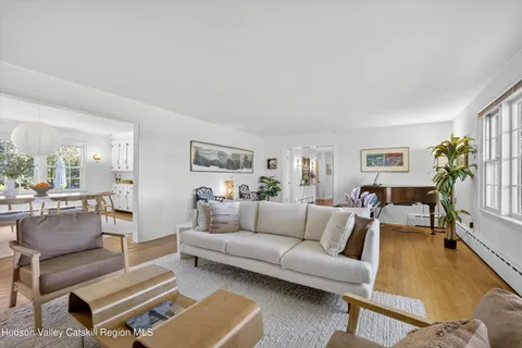 a view of backyard with swimming pool and patio