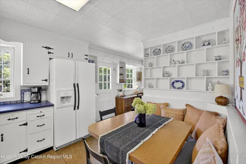 an aerial view of a residential houses with yard