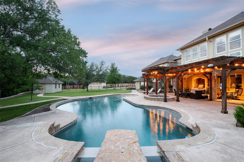 2312 Cactus Rio Lane Weatherford, TX 76087 - Photo 33 of 37 a view of a swimming pool with outdoor seating and plants