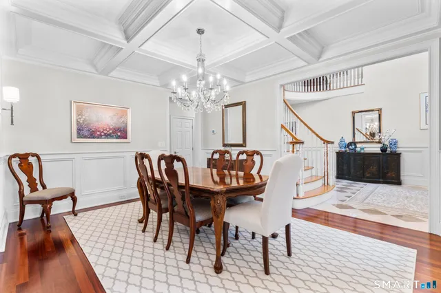 a spacious bedroom with a bed a couch and dresser