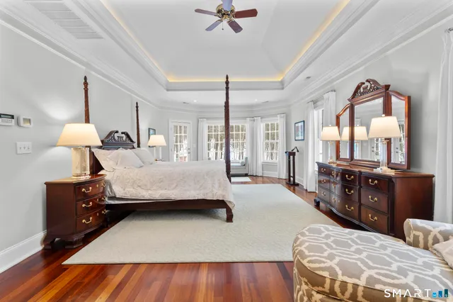 a spacious bathroom with a tub sink and mirror