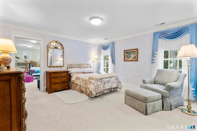 a bed room with a bed and a dresser