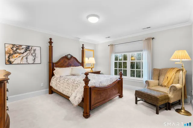 a living room with furniture gym equipment and a rug