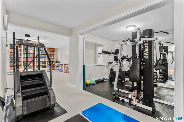 a view of hallway with window and stairs