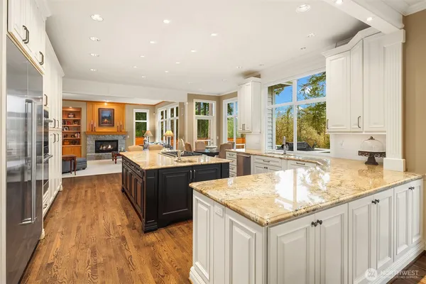 a kitchen with a stove sink and cabinets
