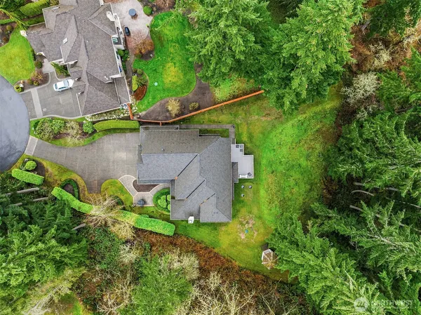 an aerial view of a house with a yard