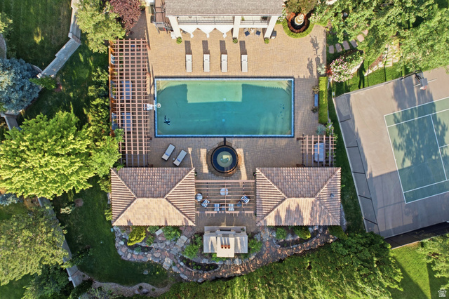 12308 Mariah Circle Draper, UT 84020 - Photo 132 of 293 Expansive outdoor living area featuring a rectangular swimming pool, integrated spa, and a full-size tennis court