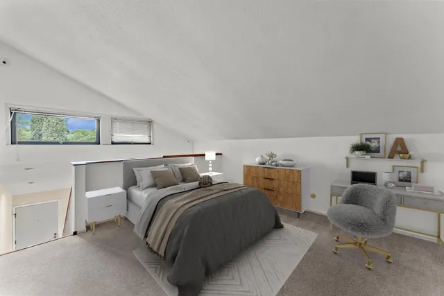 a bedroom with a bed and a couch