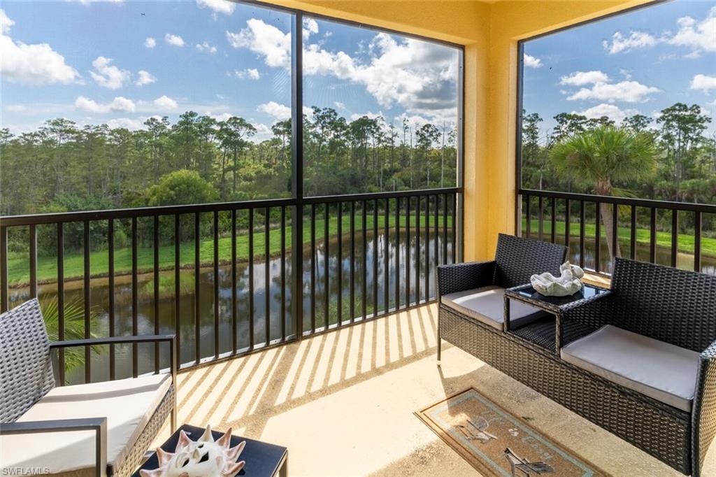 9596 Trevi Court, Unit 5446 Naples, FL 34113 - Photo 23 of 50 a balcony with furniture and wooden floor