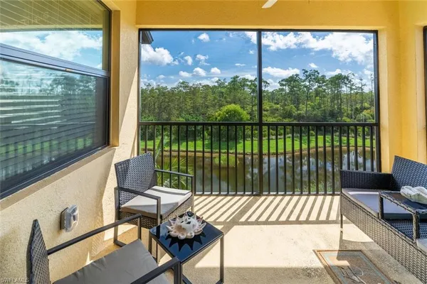 an aerial view of a house with a swimming pool yard and outdoor seating
