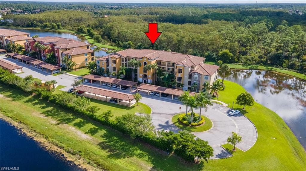 9596 Trevi Court, Unit 5446 Naples, FL 34113 - Photo 25 of 50 an aerial view of a house with a swimming pool yard and outdoor seating