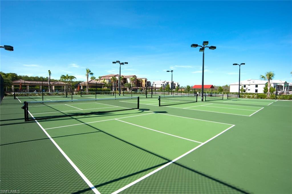 9596 Trevi Court, Unit 5446 Naples, FL 34113 - Photo 27 of 50 a view of a tennis court