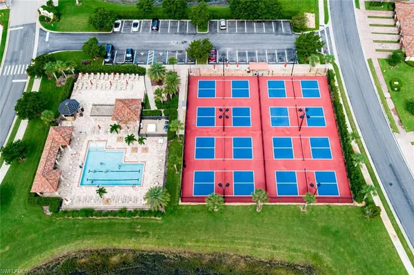an aerial view of residential houses with outdoor space and river