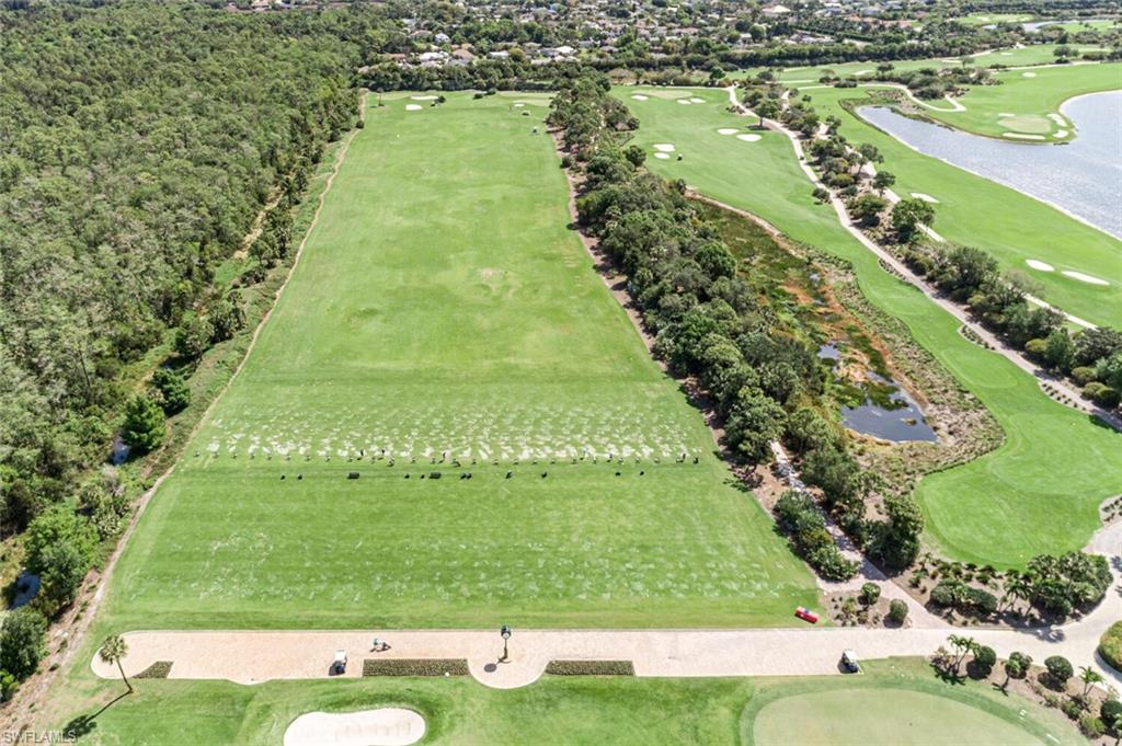 9596 Trevi Court, Unit 5446 Naples, FL 34113 - Photo 39 of 50 an aerial view of tennis court