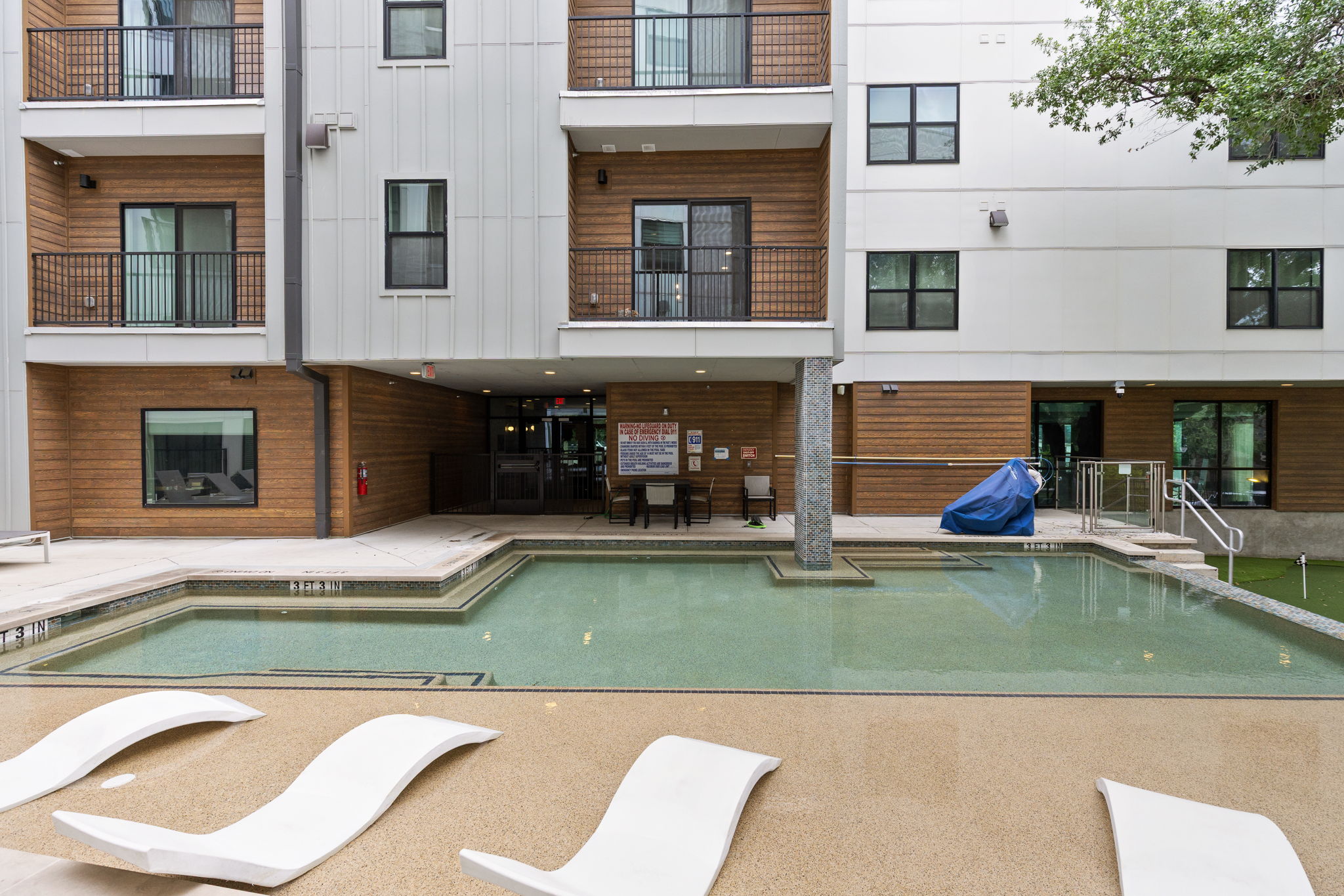 2500 Longview Street, Unit 507 Austin, TX 78705 - Photo 34 of 37 Unwind by the inviting outdoor pool with plenty of space for relaxation.