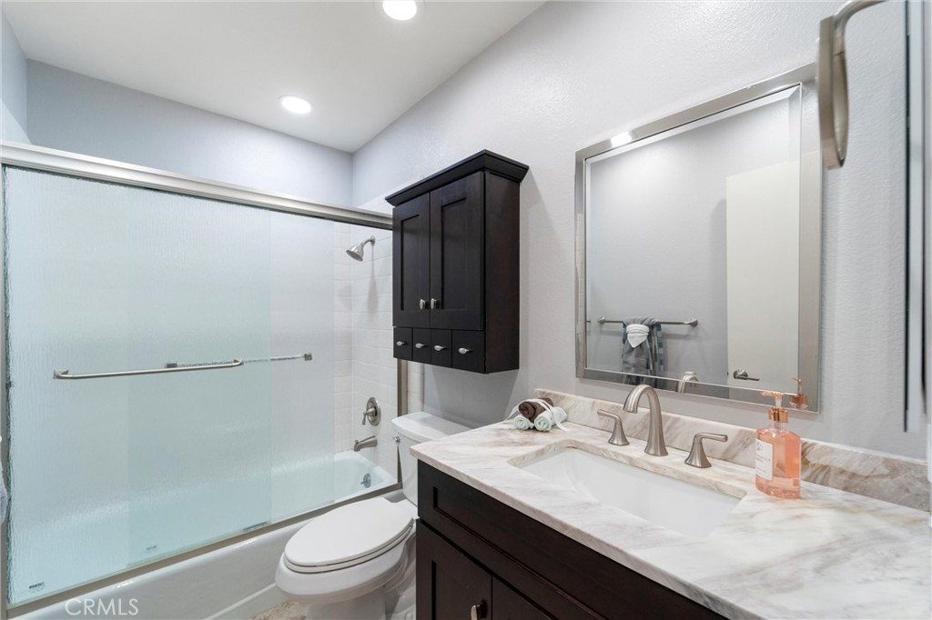607 Valley Forge Drive Placentia, CA 92870 - Photo 30 of 57 a bathroom with a granite countertop sink toilet and shower