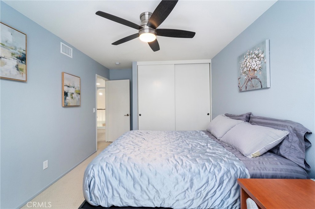 607 Valley Forge Drive Placentia, CA 92870 - Photo 39 of 57 a bedroom with a bed and a painting on the wall