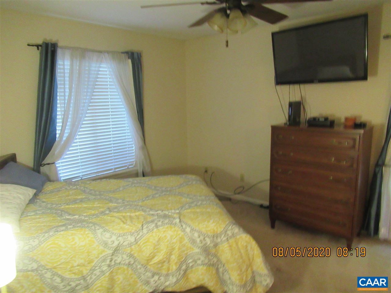 2 Ridgeview Circle Charlottesville, VA 22902 - Photo 11 of 22 a bedroom with a bed and flat screen tv