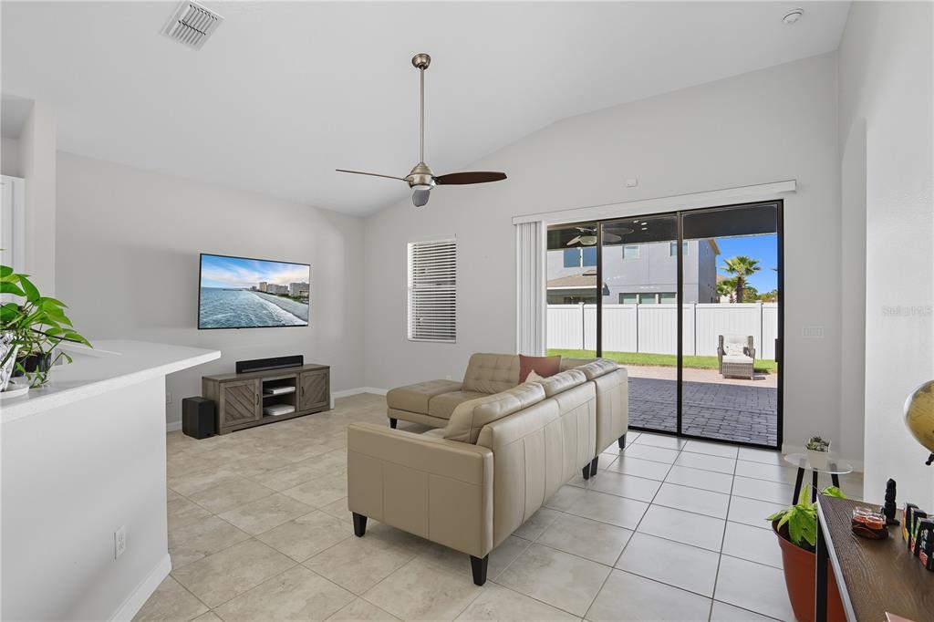12154 Beach Fern Road Orlando, FL 32824 - Photo 13 of 34 a living room with furniture and a flat screen tv