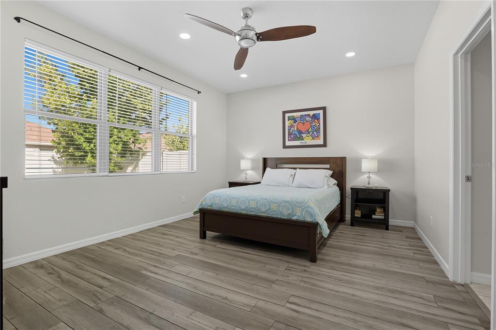 12154 Beach Fern Road Orlando, FL 32824 - Photo 14 of 34 a bedroom with a bed and a window