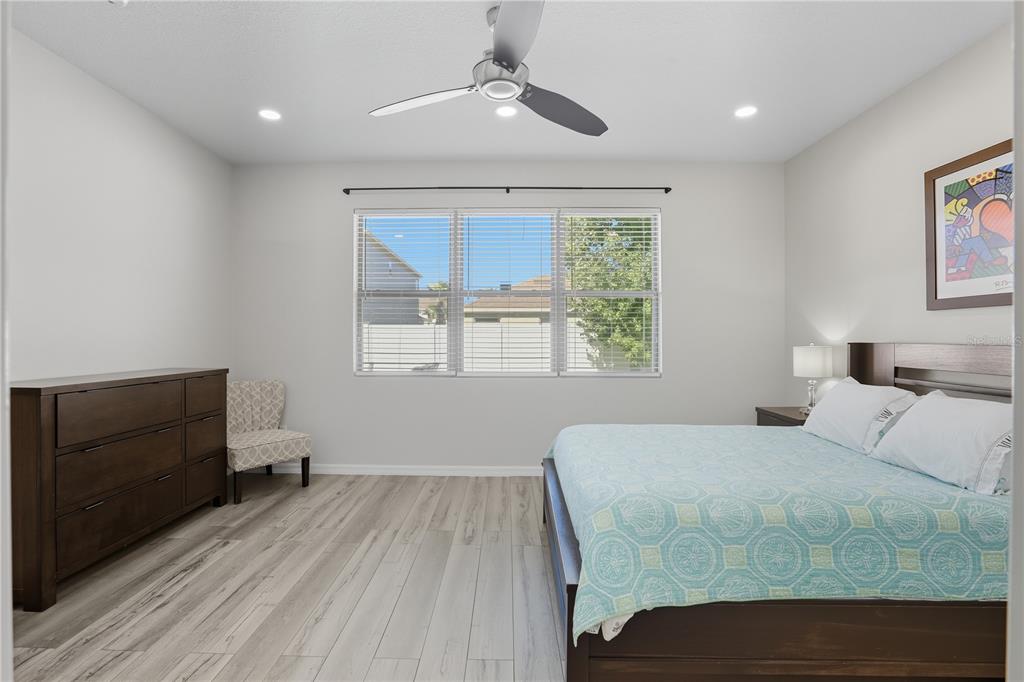 12154 Beach Fern Road Orlando, FL 32824 - Photo 22 of 34 a bedroom with a bed and a window