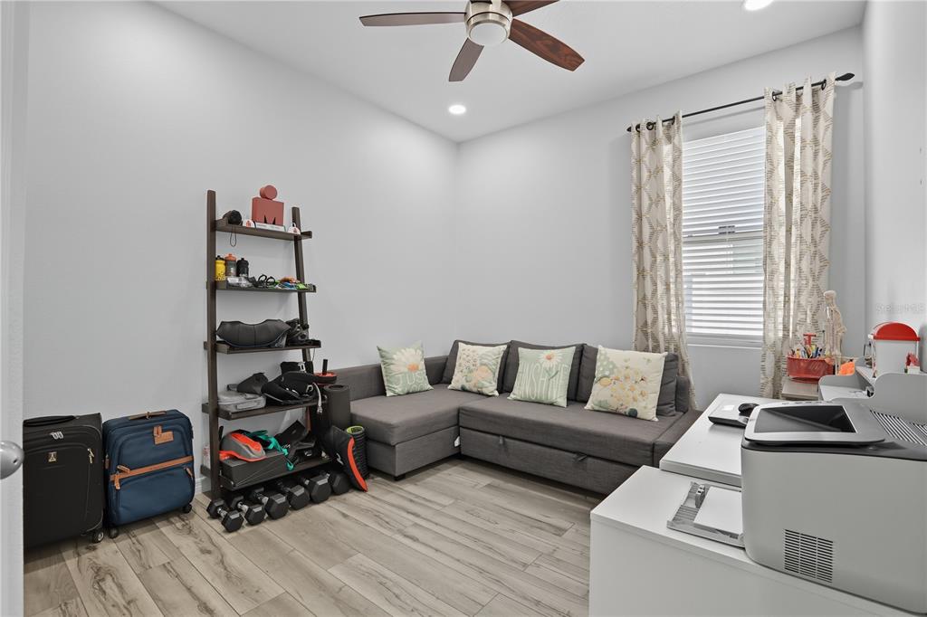 12154 Beach Fern Road Orlando, FL 32824 - Photo 24 of 34 a living room with furniture and a window