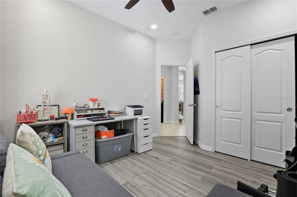 12154 Beach Fern Road Orlando, FL 32824 - Photo 25 of 34 a kitchen with stainless steel appliances a stove a sink and a refrigerator