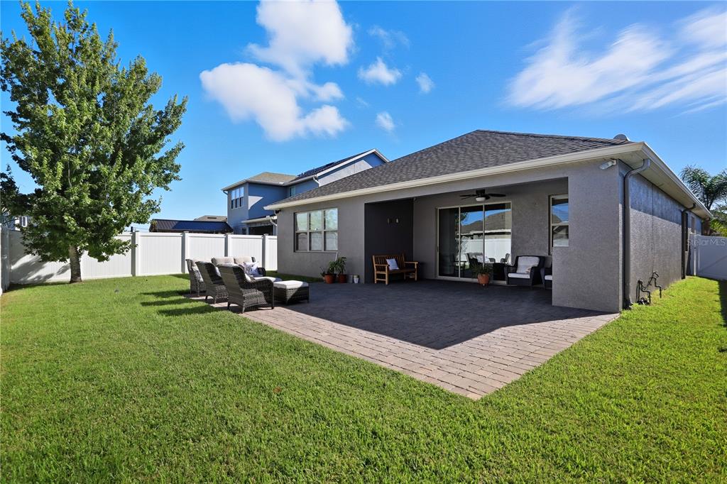 12154 Beach Fern Road Orlando, FL 32824 - Photo 29 of 34 a view of a house with backyard and sitting area