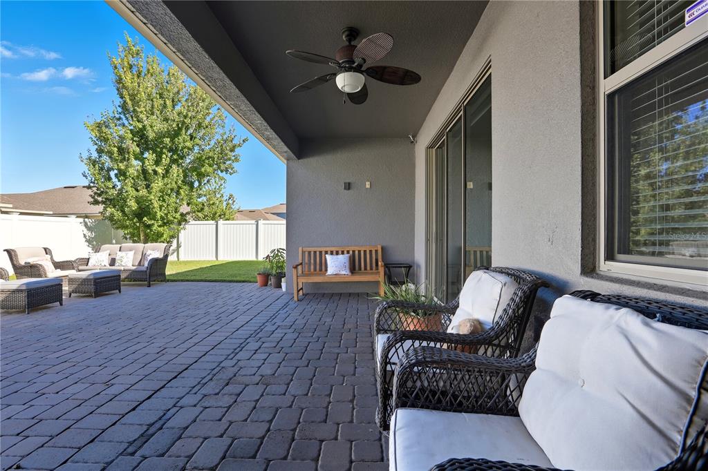12154 Beach Fern Road Orlando, FL 32824 - Photo 30 of 34 a living room with furniture and a fireplace