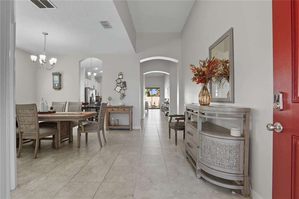12154 Beach Fern Road Orlando, FL 32824 - Photo 3 of 34 a view of a dining room with furniture and chandelier