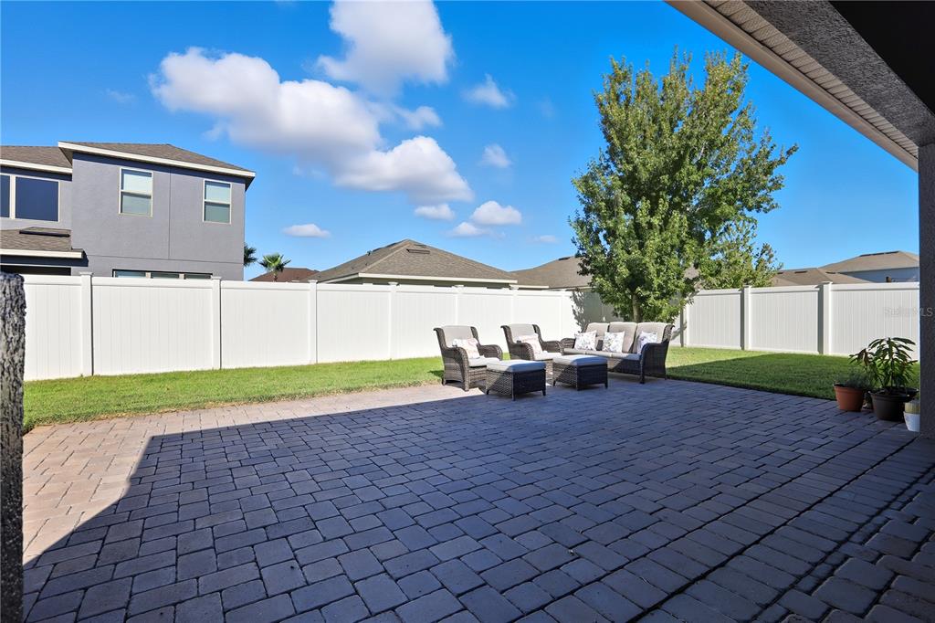 12154 Beach Fern Road Orlando, FL 32824 - Photo 31 of 34 a view of a house with a yard and sitting area