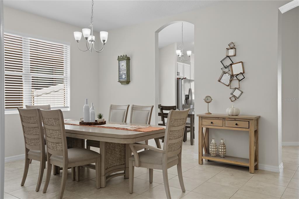 12154 Beach Fern Road Orlando, FL 32824 - Photo 4 of 34 a view of a dining room with furniture and chandelier