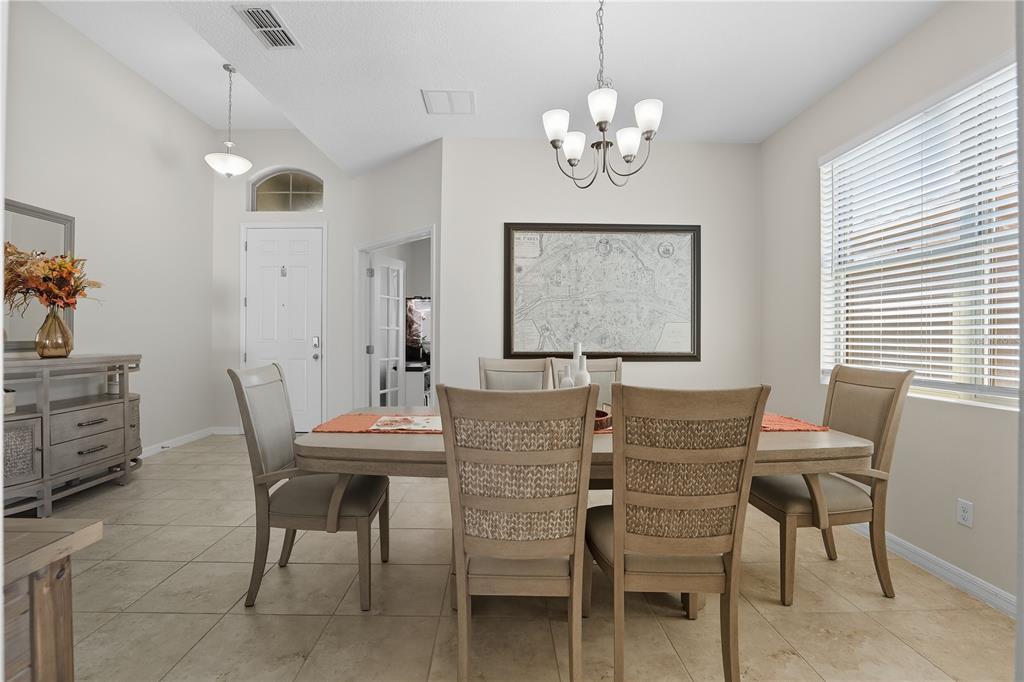 12154 Beach Fern Road Orlando, FL 32824 - Photo 5 of 34 a view of a dining room with furniture and chandelier