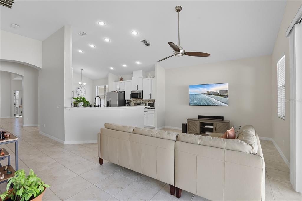 12154 Beach Fern Road Orlando, FL 32824 - Photo 7 of 34 a living room with furniture and a flat screen tv