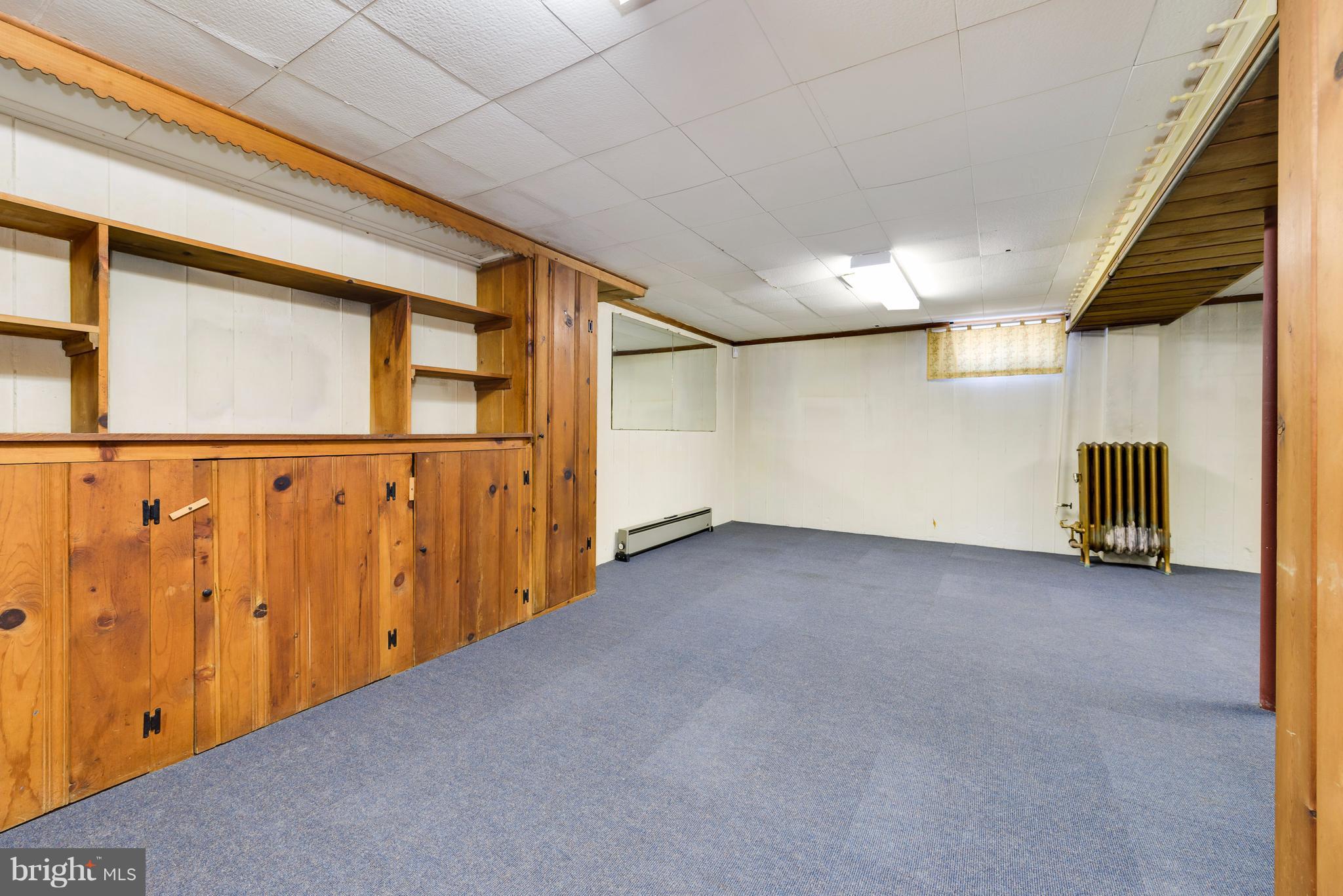 2807 Munson Street Silver Spring, MD 20902 - Photo 23 of 30 Lower level with reclaimed wood paneling/shelves