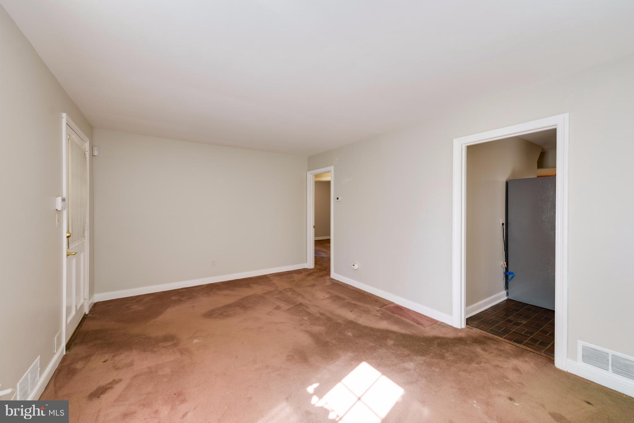2807 Munson Street Silver Spring, MD 20902 - Photo 5 of 30 Living room has wood floors under carpet