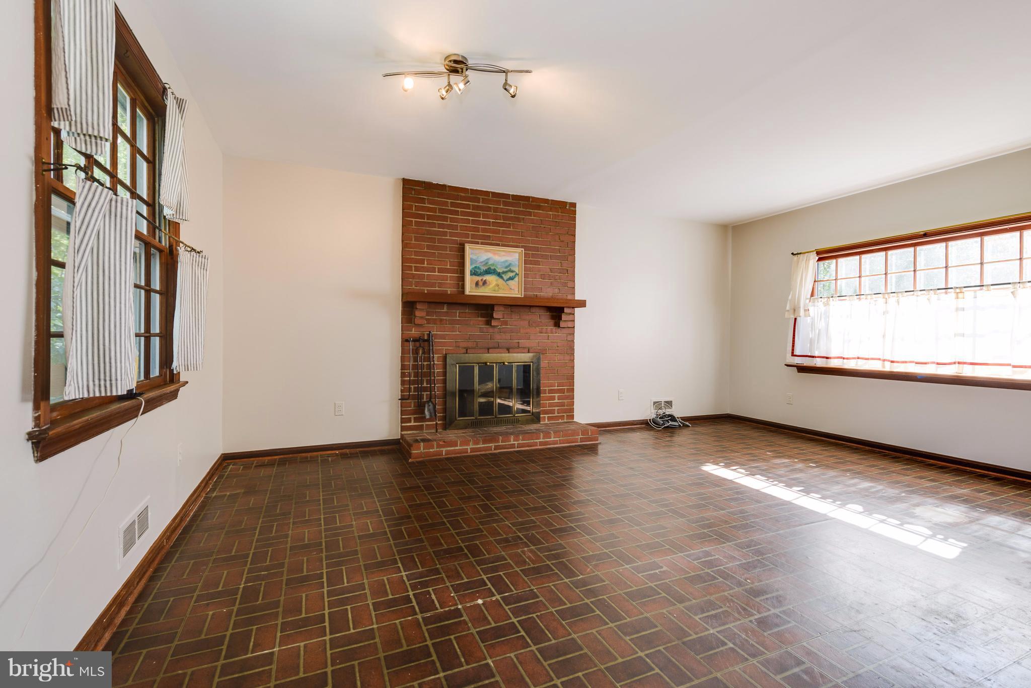 2807 Munson Street Silver Spring, MD 20902 - Photo 10 of 30 Family room with cozy wood-burning fireplace