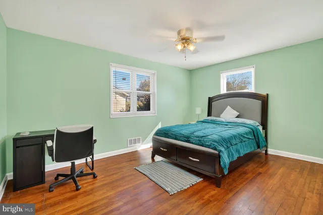 a bedroom with a bed and a table