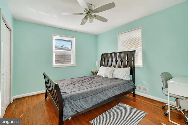 a bedroom with a bed and a table