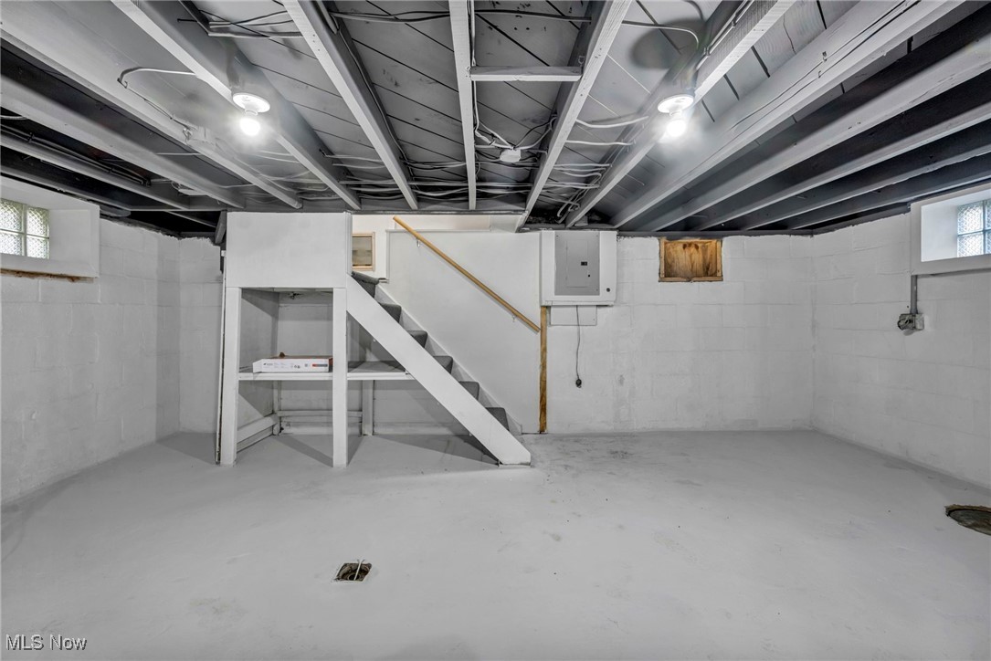 503 Churchill Road Youngstown, OH 44505 - Photo 20 of 32 Below grade area featuring stairs and electric panel