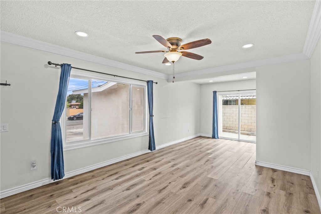 10028 Primrose Drive Riverside, CA 92503 - Photo 5 of 19 a view of empty room with wooden floor and fan