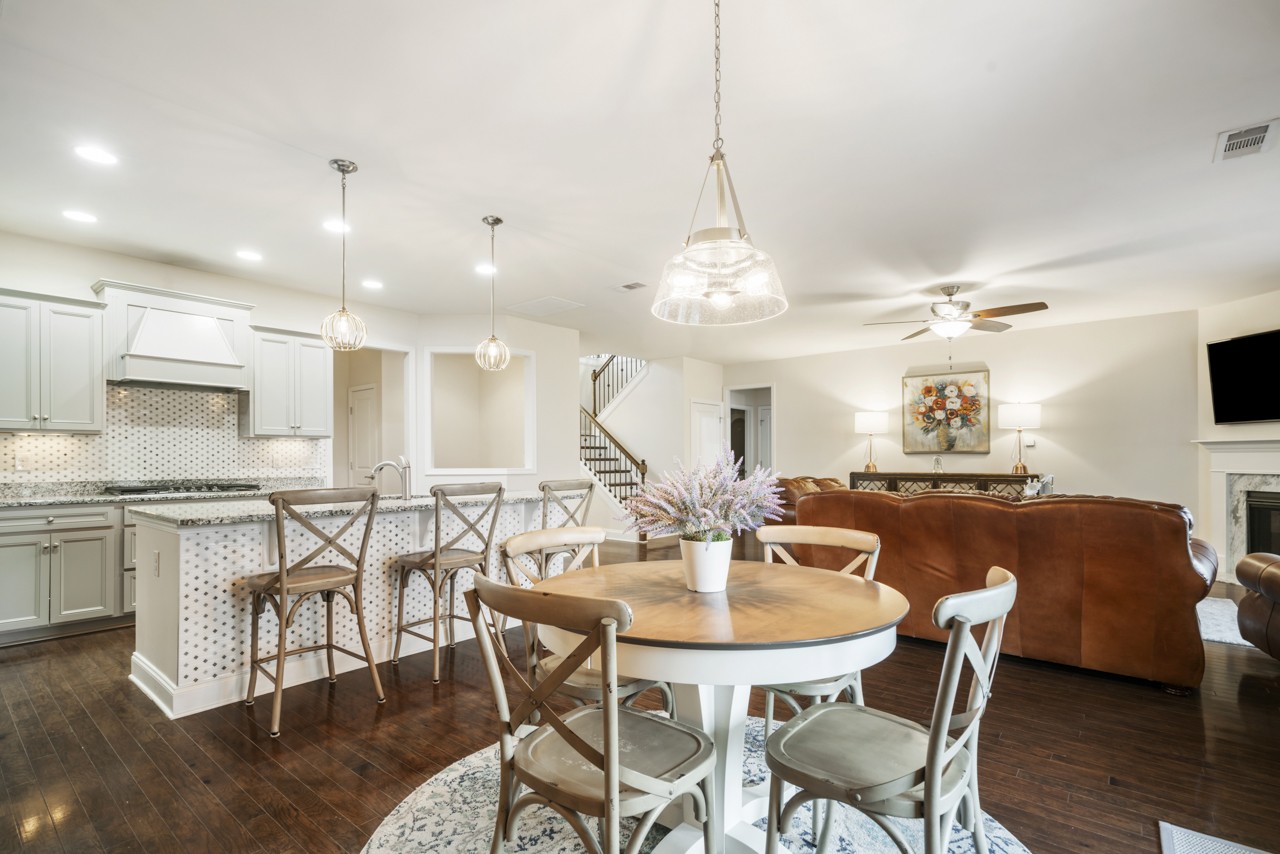 2995 Liverpool Drive Spring Hill, TN 37174 - Photo 12 of 37 a view of a dining room with furniture and wooden floor