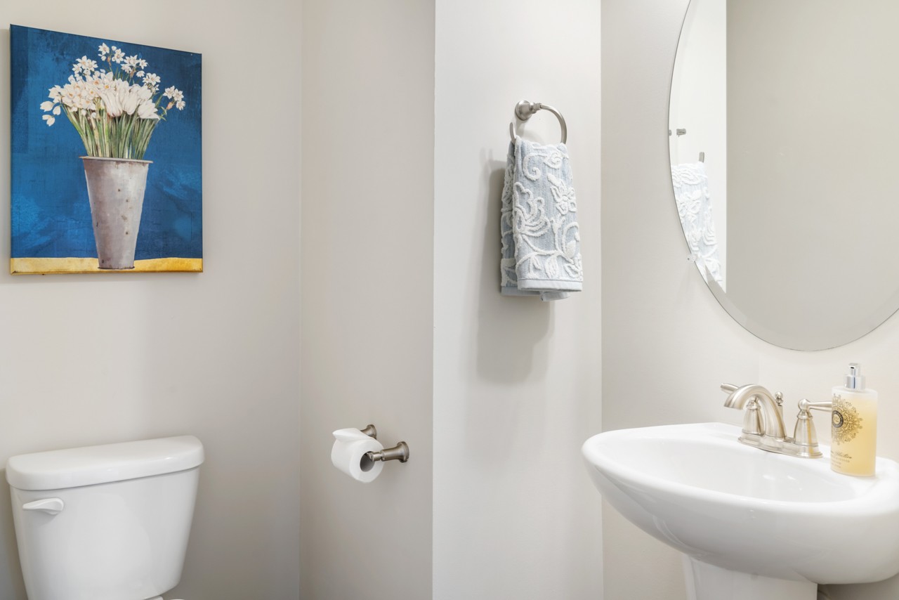 2995 Liverpool Drive Spring Hill, TN 37174 - Photo 15 of 37 a bathroom with a toilet a sink and mirror
