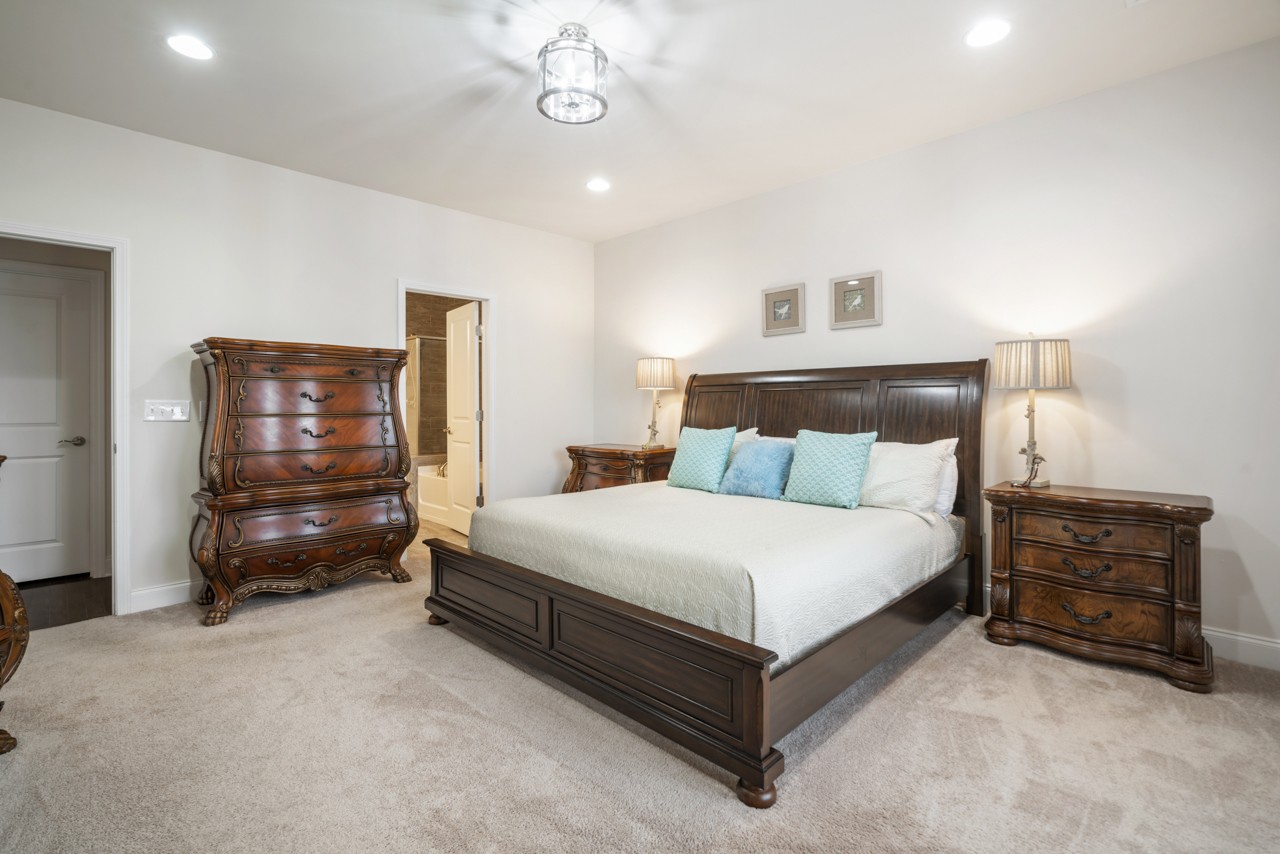 2995 Liverpool Drive Spring Hill, TN 37174 - Photo 17 of 37 a bedroom with a bed and a chair