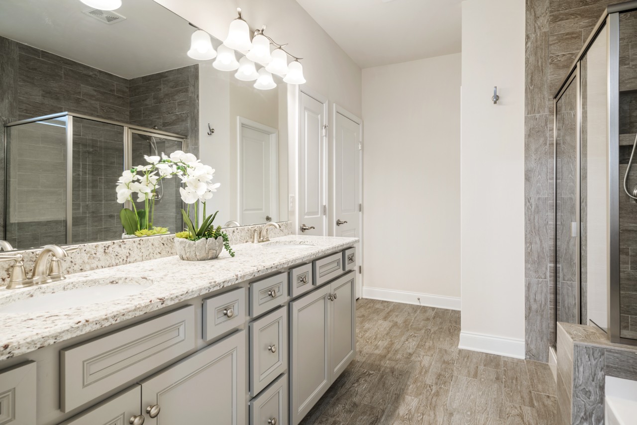 2995 Liverpool Drive Spring Hill, TN 37174 - Photo 19 of 37 a bathroom with a double vanity sink and a mirror