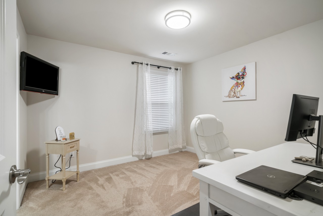 2995 Liverpool Drive Spring Hill, TN 37174 - Photo 25 of 37 a room with a couch and a flat screen tv