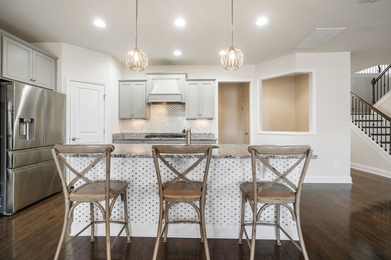 2995 Liverpool Drive Spring Hill, TN 37174 - Photo 10 of 37 a view of a dining room with furniture and wooden floor