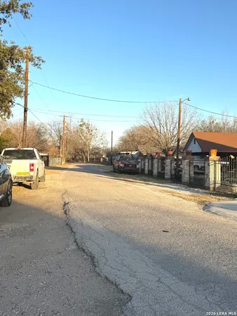 a view of a street with a building on the road