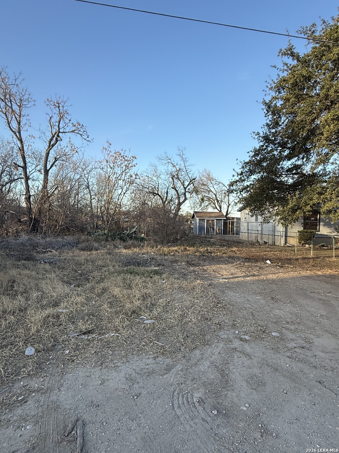 13630 Interstate 35 Access Road Von Ormy, TX 78073 - Photo 10 of 12 a view of dirt field with large trees