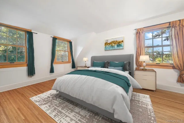 a bedroom with a large bed and a window